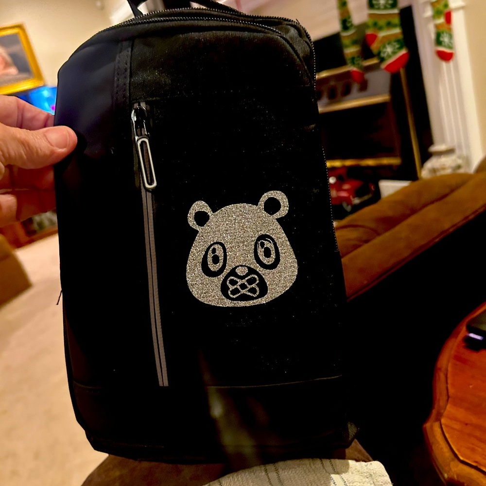 Ownyc bag with charger. In new condition. I won it and have not used it.